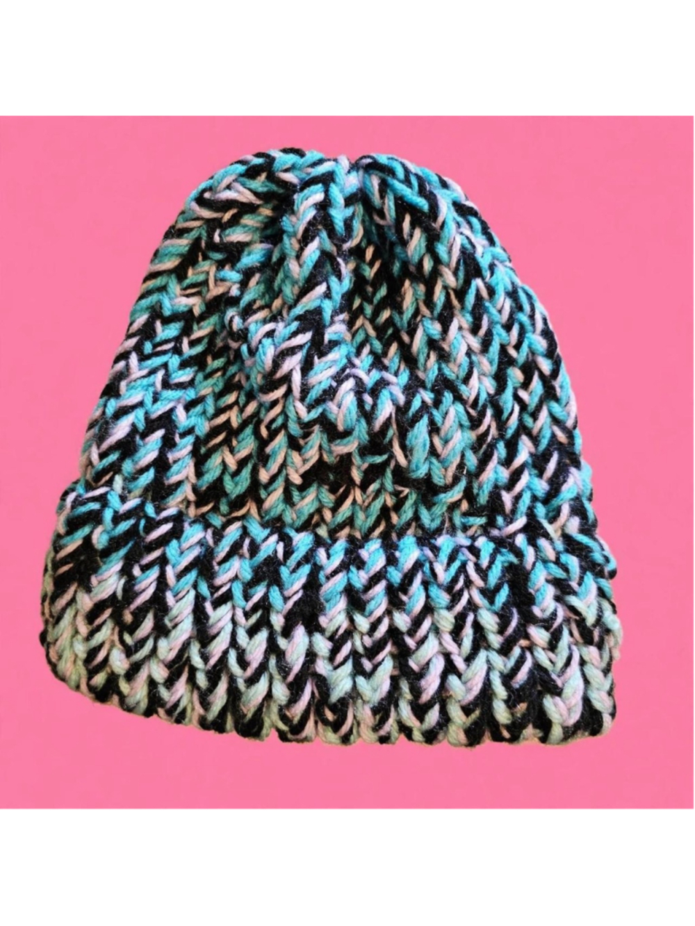 Handmade knit beanie with blue, black, and white yarn in a chevron pattern #hand